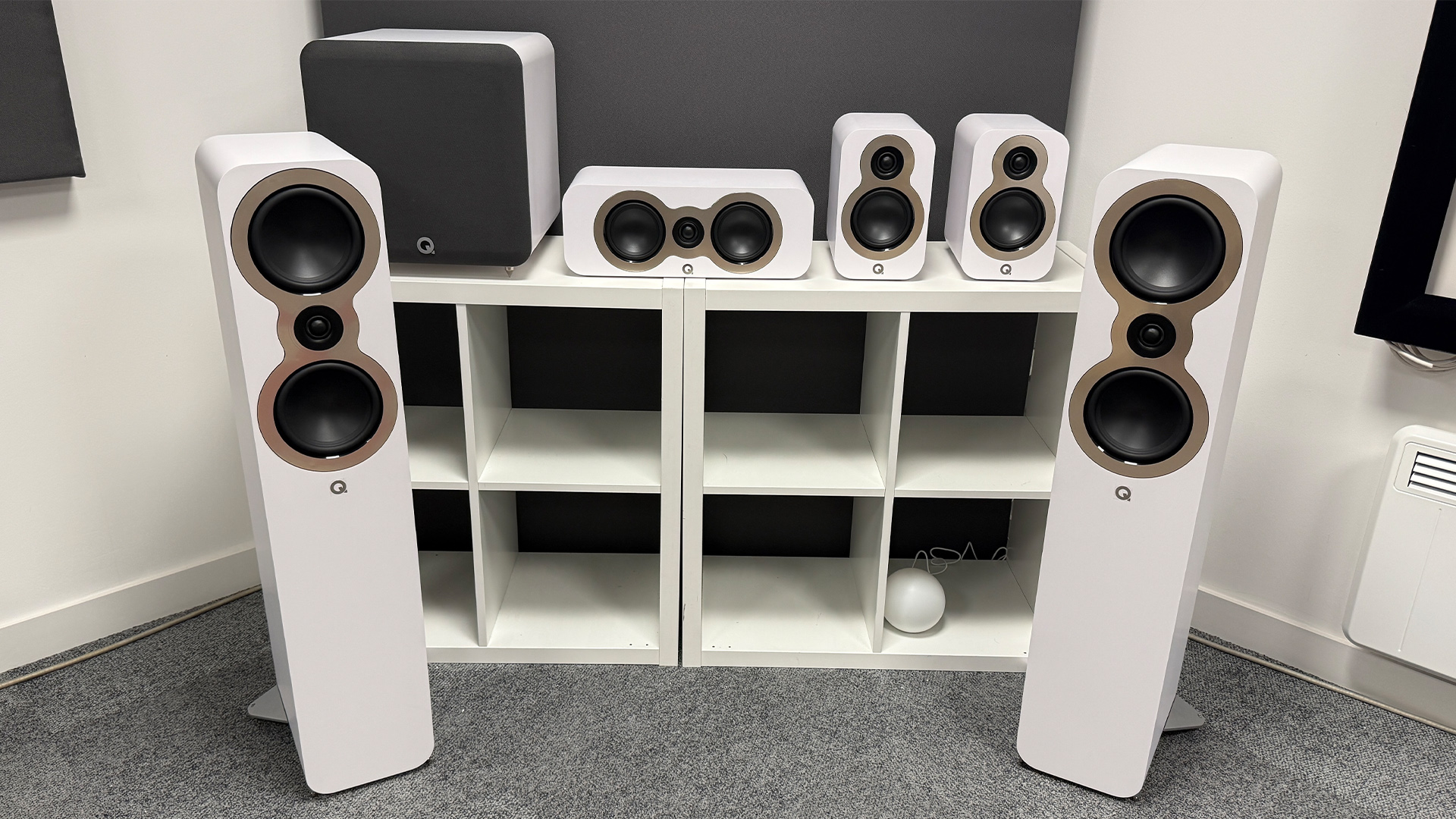 Q Acoustics 3050c 5.1 home cinema speaker package on grey carpet in test room