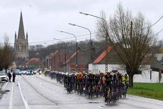 WEVELGEM BELGIUM MARCH 26 LR Jos Van Emden of The Netherlands and Team JumboVisma and Tim Declercq of Belgium and Team Soudal Quick Step leads the peloton during the 85th GentWevelgem in Flanders Fields 2023 Mens Elite a 2609km one day race from Ypres to Wevelgem UCIWT on March 26 2023 in Wevelgem Belgium Photo by Tim de WaeleGetty Images