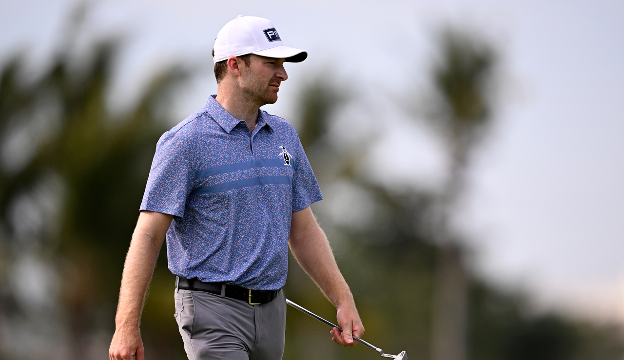 Brian Campbell walks on the green with a putter