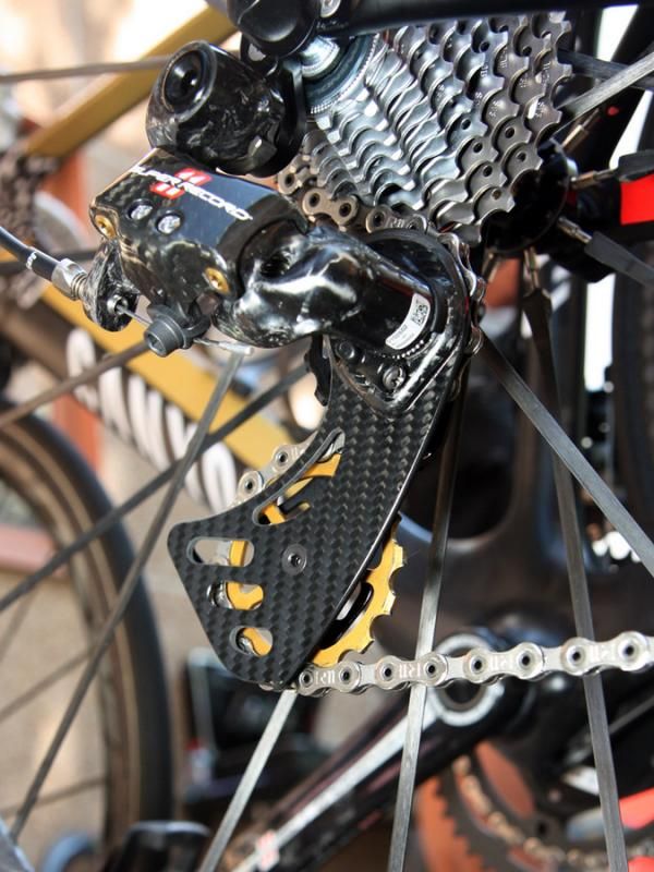 Philippe Gilbert (Omega Pharma-Lotto) is running a Berner carbon fiber cage on his Campagnolo Super Record rear derailleur with dual oversized pulleys that are said to reduce drivetrain friction.