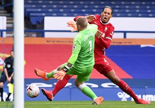 Van Dijk (right) damaged ligaments in his right knee against Everton