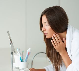 face in mirror, woman, skin, looking at skin