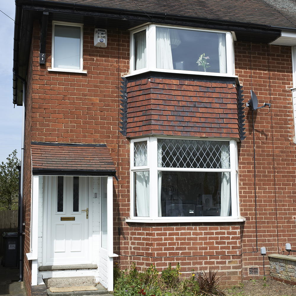 exterior of house with brick wall white door