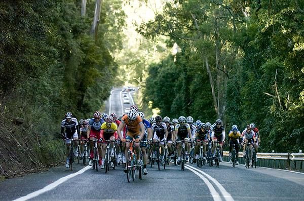 The chasing peloton on a small climb trying to bridge a gap of twenty seconds to a group ahead.