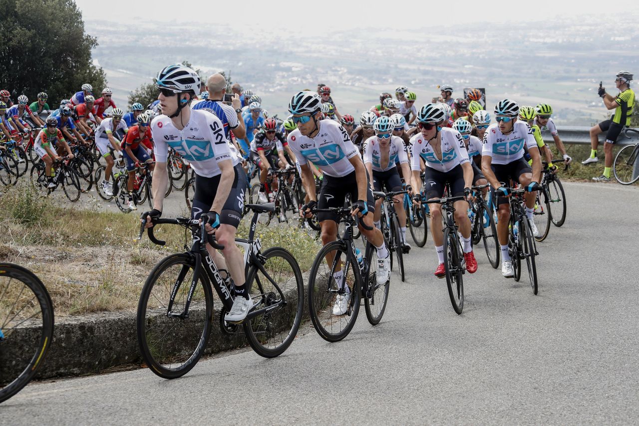 Team Sky ride up a hill