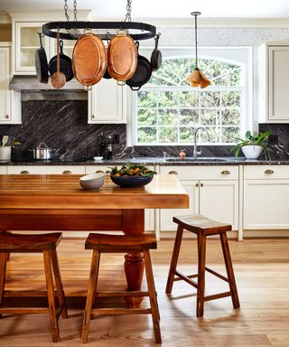 Butcher's block kitchen island contrasting with white cabinetry