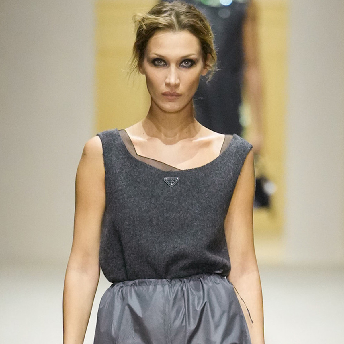 A photo of Bella Hadid walking in at the Prada F/W 26 show during Milan Fashion Week.