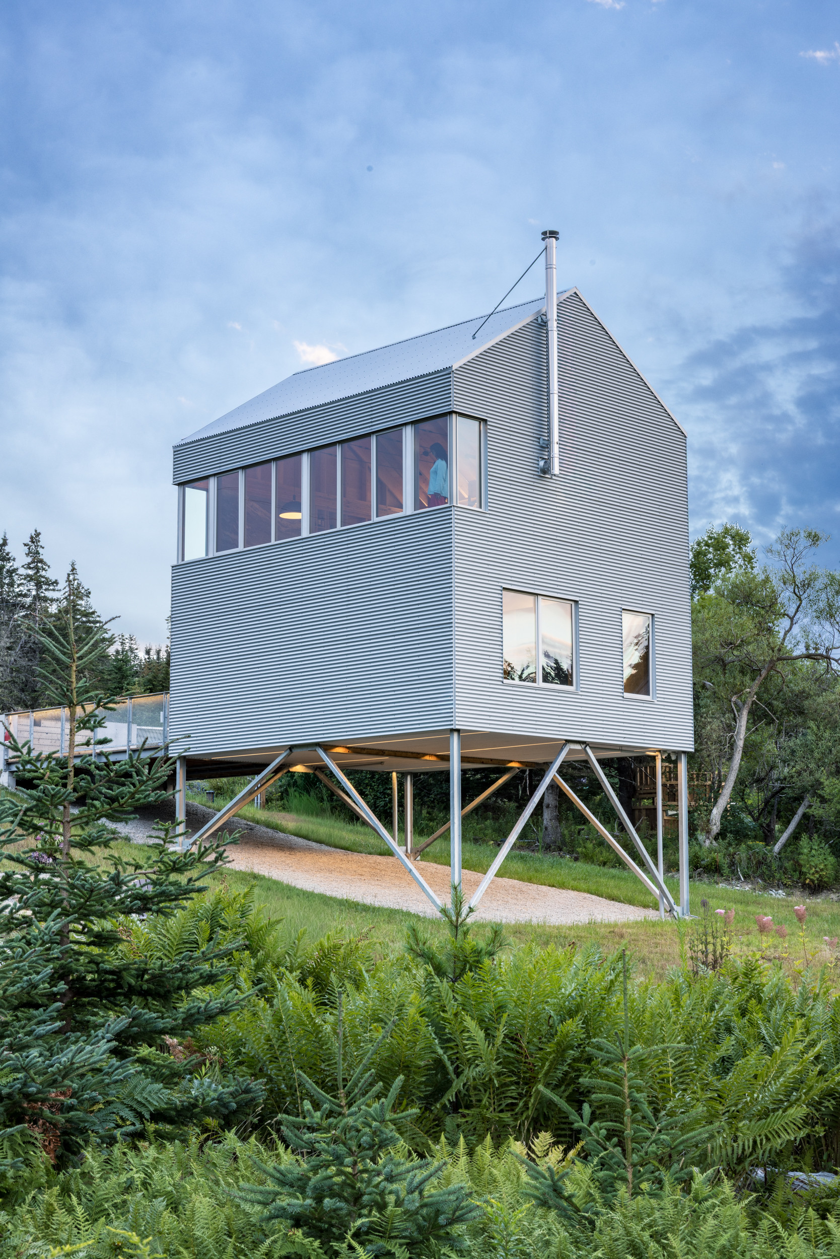 The house is raised up above the landscape