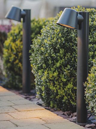 post lamps along path by oliver bonas