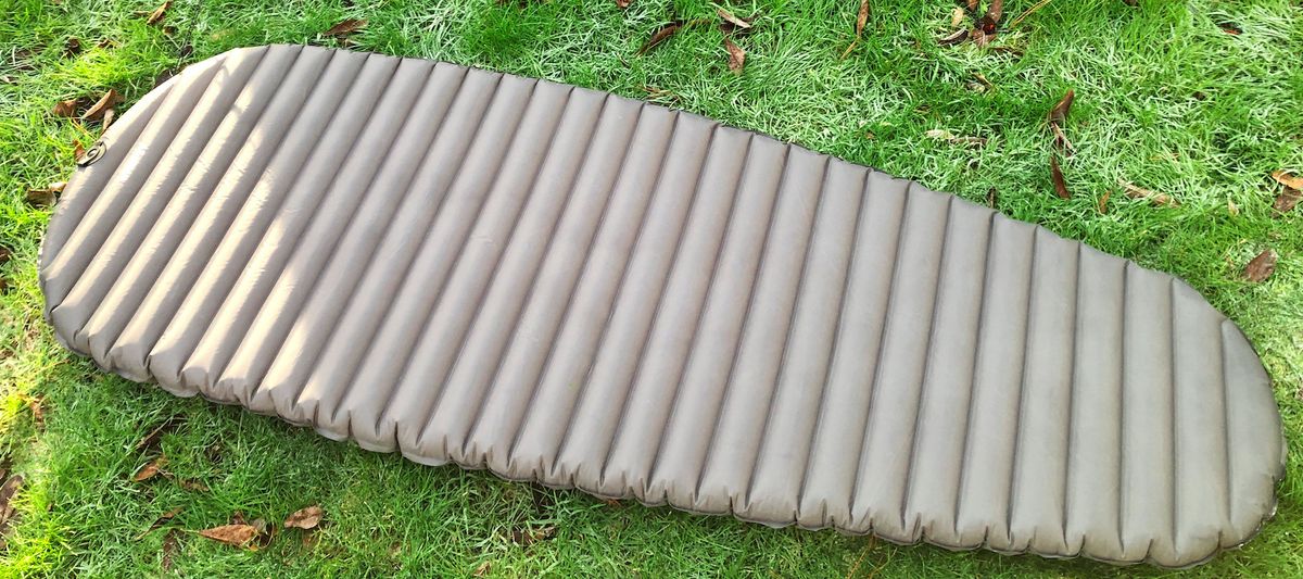 Alpkit Whisper sleeping mat on grass