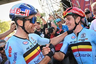 Belgian Wout van Aert and Belgian Remco Evenepoel celebrates after winning the mens elite road race at the UCI Road World Championships Cycling 2022 in Wollongong Australia Sunday 25 September 2022 