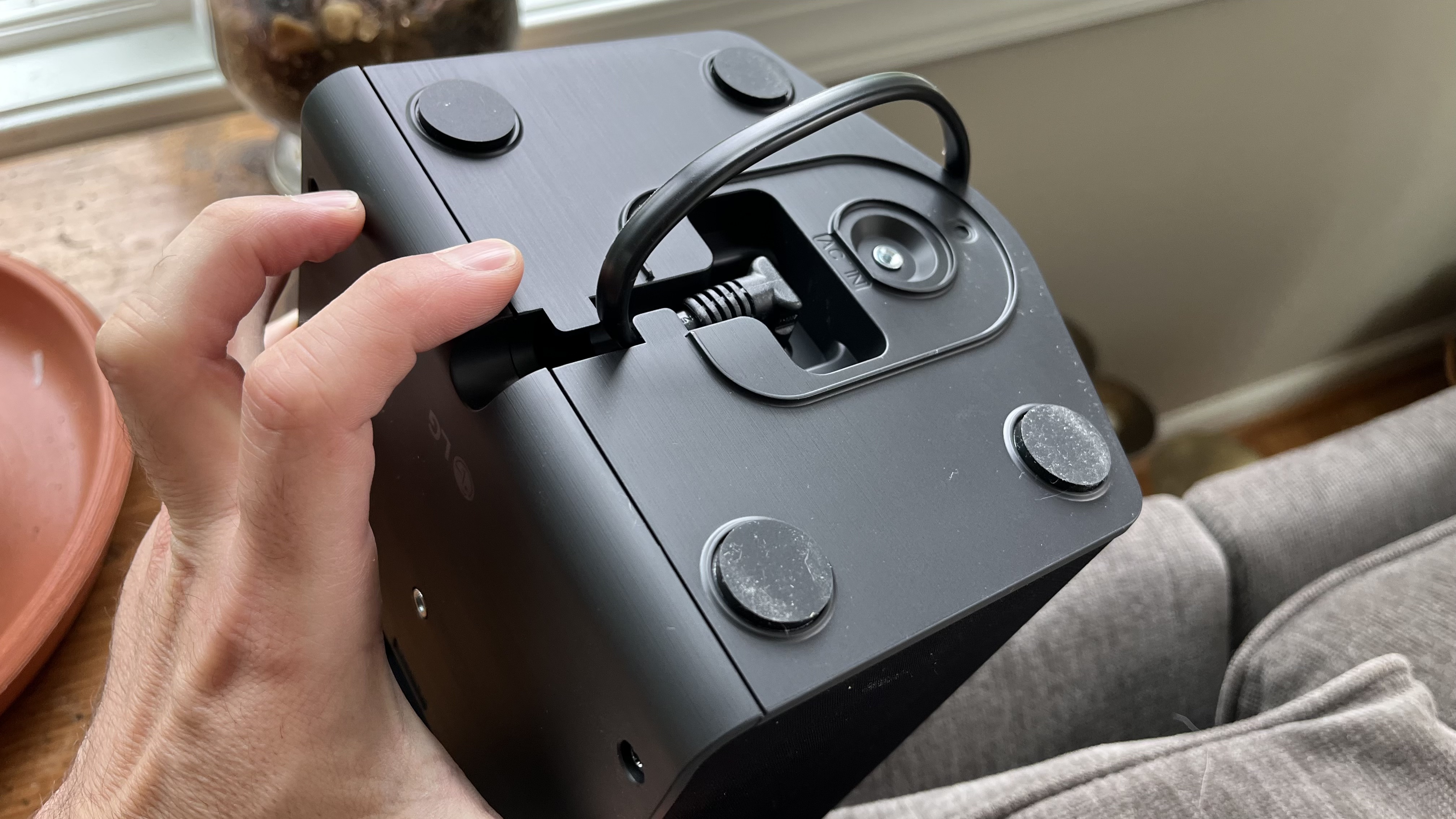 LG S95AR rear speaker recessed power port being demonstrated