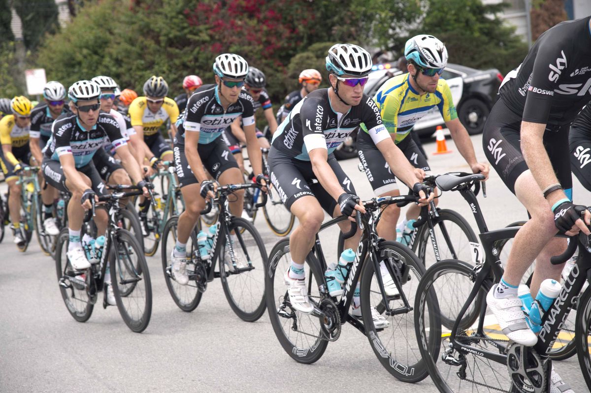 Mark Cavendish in the green jersey is protected by his Etixx-Quick Step teammates
