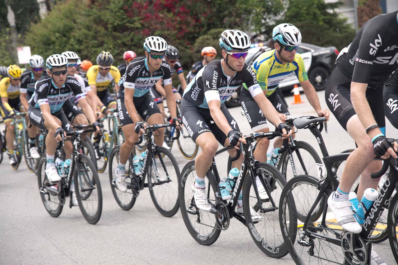 Mark Cavendish in the green jersey is protected by his Etixx-Quick Step teammates