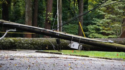 A view of a fallen power line and flooded street in Georgia due to Hurricane Helene. 