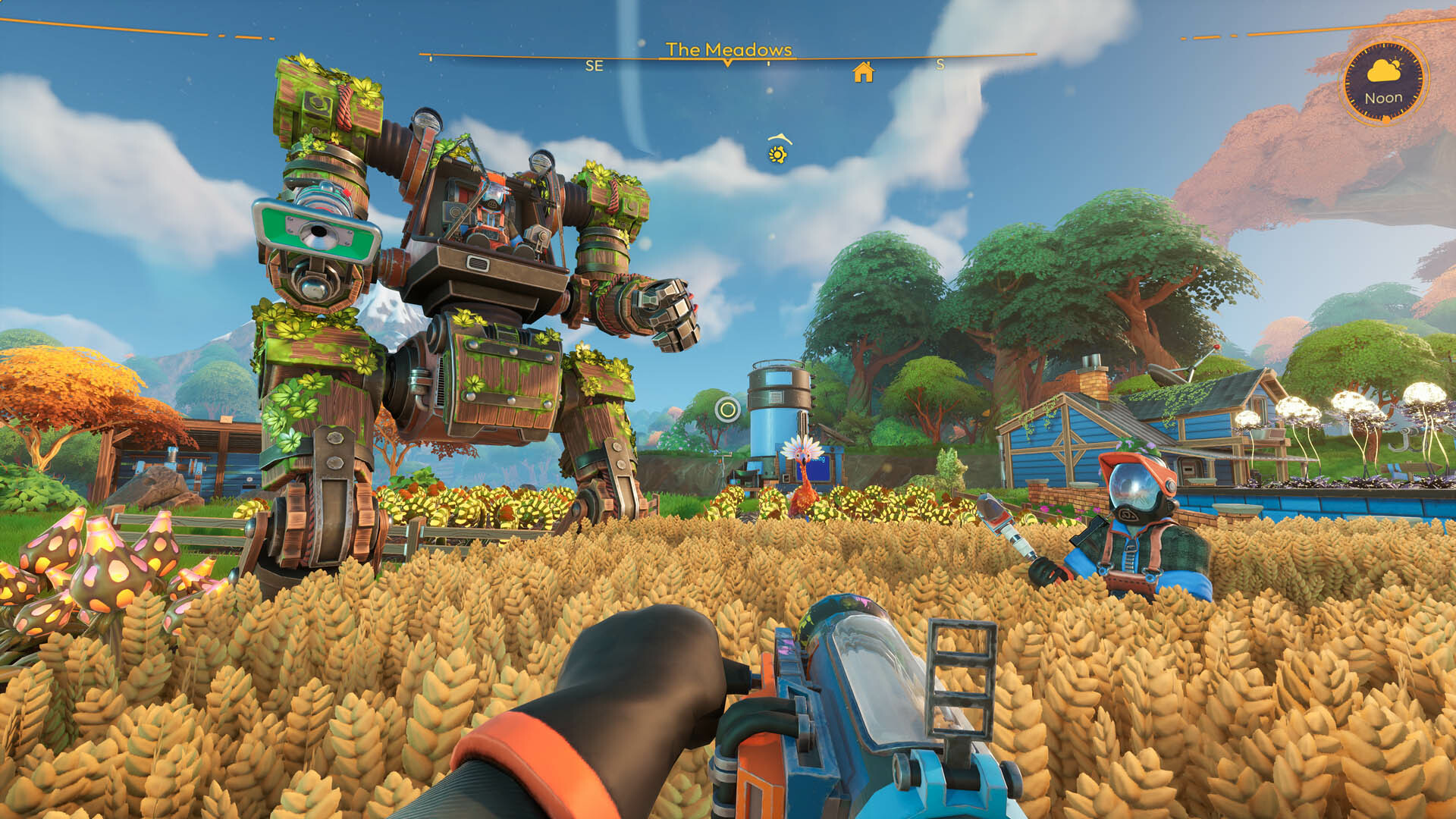 Lightyear Frontier - In first person a player stands in a golden field of wheat while another player and a leaf-covered mech stand nearby