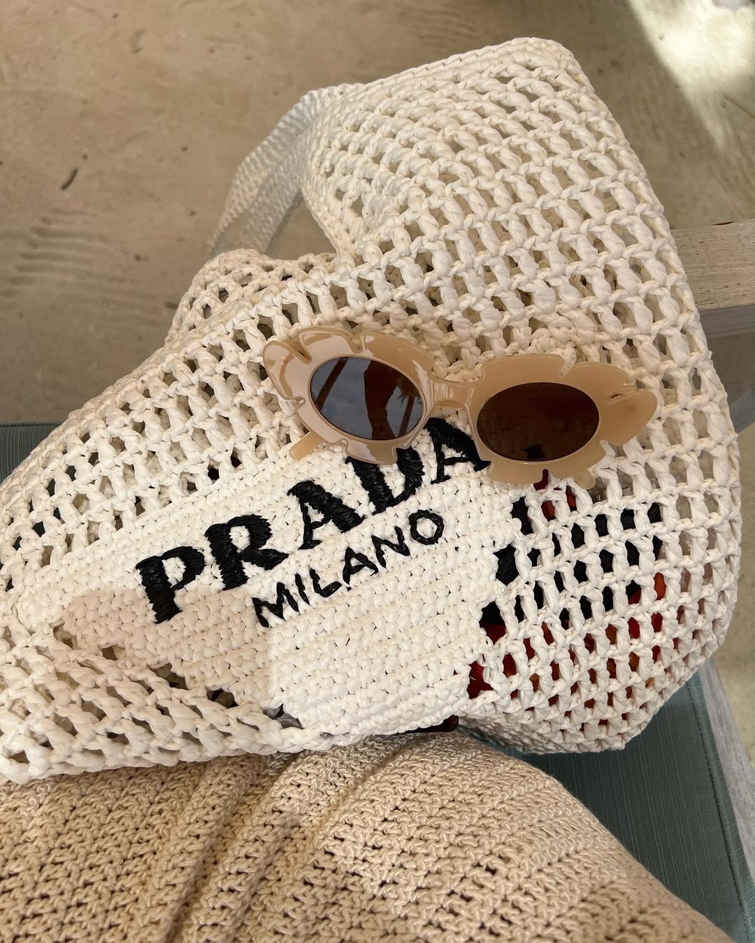 Sofia Richie shares her crochet Prada tote on Instagram in May 2023.