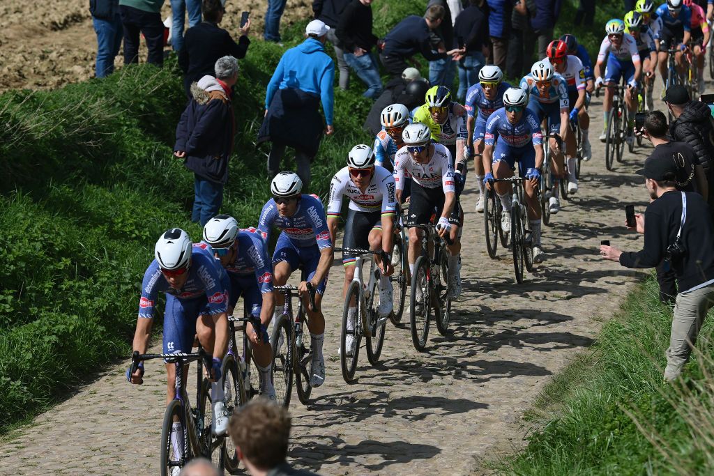 ROUBAIX FRANCE APRIL 07 LR Mathieu van der Poel of The Netherlands and Team Alpecin Deceuninck and Tim Wellens of Belgium and UAE Team Emirates compete passing through the Viesly Quivy cobblestones sector during the 121st ParisRoubaix 2024 a 2597km one day race from Compiegne to Roubaix UCIWT on April 07 2024 in Roubaix France Photo by Dario BelingheriGetty Images