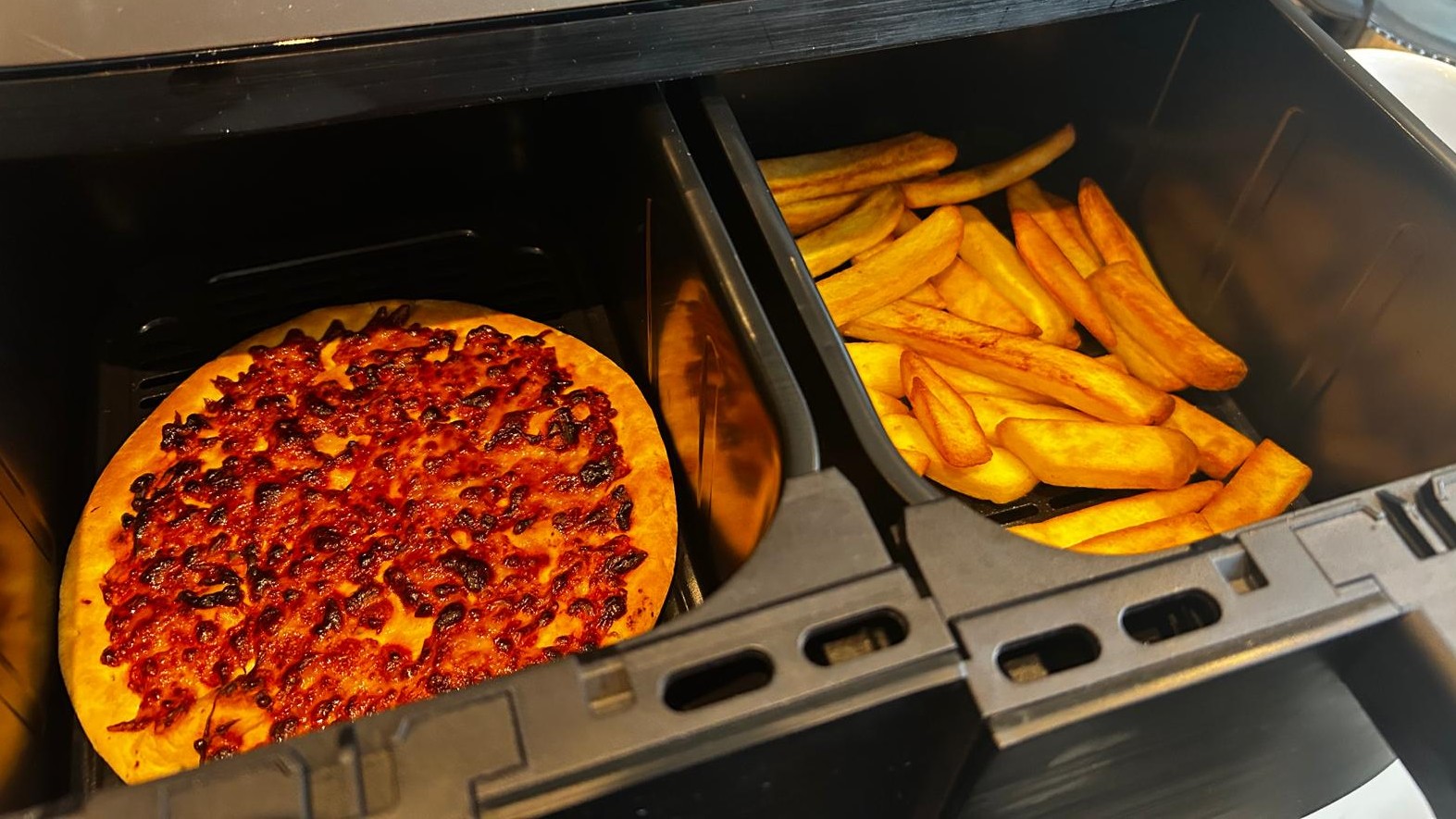 Pizza and fries cooked using Russell Hobbs Satisfry air fryer