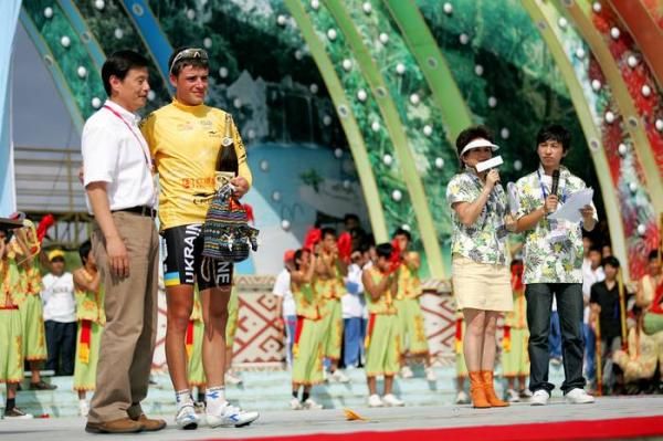 Vitaliy Buts (Ukraine) on the podium stage in the yellow jersey.