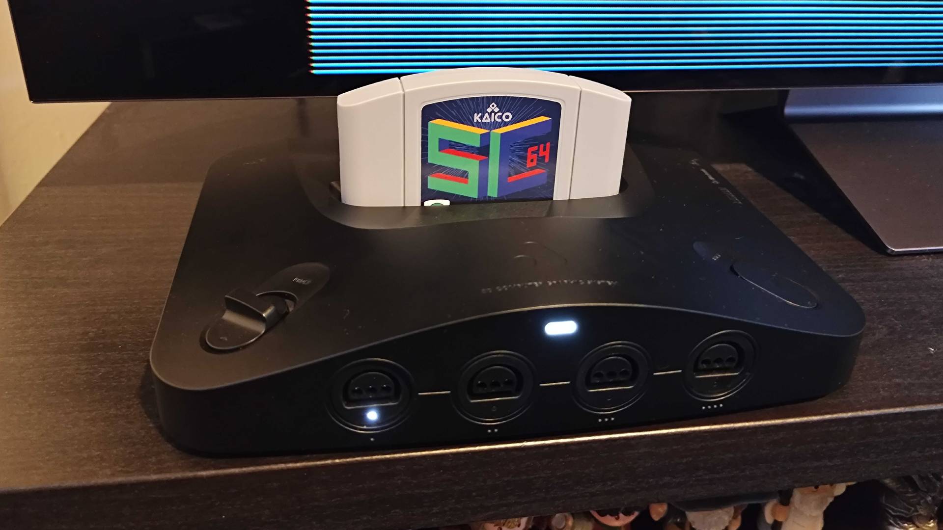 Analogue 3D with Summercart 64 inserted on black unit.