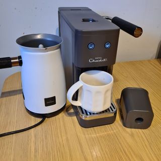 Hotel Chocolat Podster, Velvetiser and podcycler on wooden table