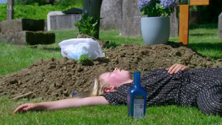 Liv drunk and passed out by Leanna's grave in Emmerdale