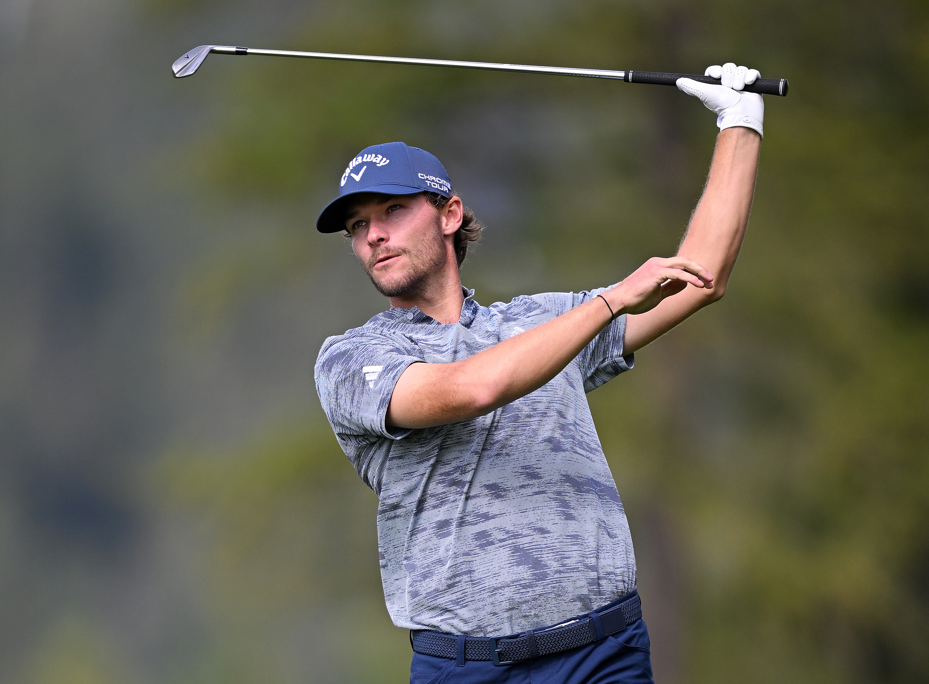 Nicolai Hojgaard watches his golf shot in the air