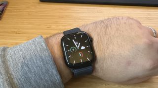 A Midnight Apple Watch Series 9 sitting on a desk