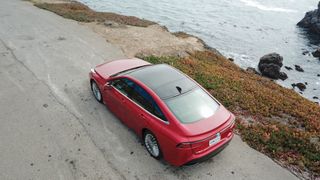 Top-down view of the Toyota Mirai (2021) parked on a coastal road