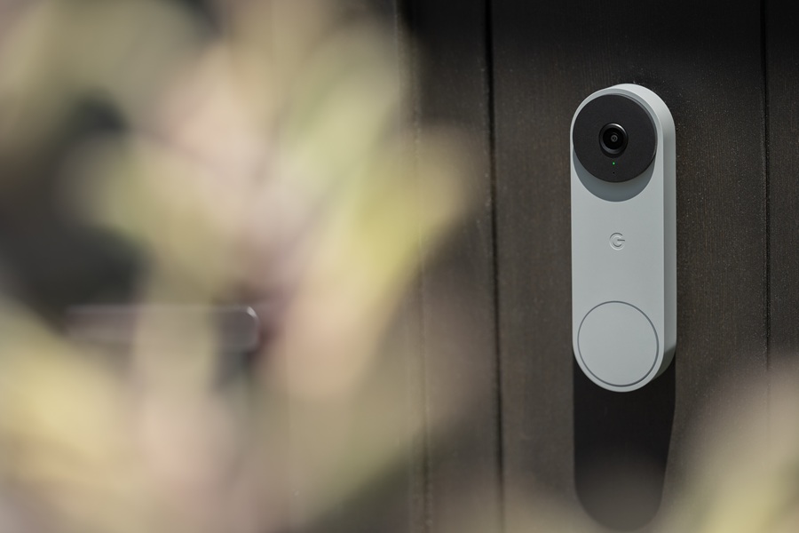 The new Google Nest Doorbell (3rd Gen) in hazel up against a door.