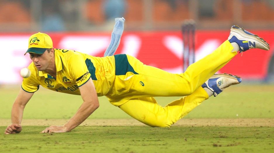 Pat Cummins dives for the ball ahead of the Australia vs Afghanistan live stream at the 2023 ICC Men&#039;s Cricket World Cup.