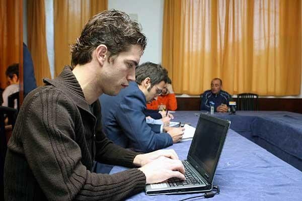 Journalists at work while the World Champion speaks.