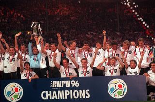 Germany players celebrate with the trophy after winning Euro 96