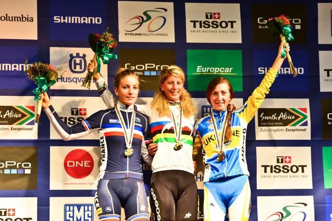 Second place Pauline Ferrand Prevot (left) of France, Winner Jolanda Neff (centre) of Switzerland and third place Yana Belomoyna (right) of Ukraine enjoy their time on the podium after the under 23 women's cross country