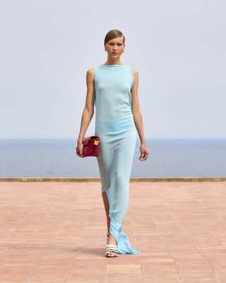 Model wearing turquoise on the runway at the Jacquemus fall/winter 2024 show.