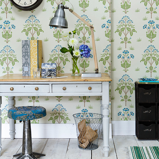 home office with floral wallpaper and painted desk