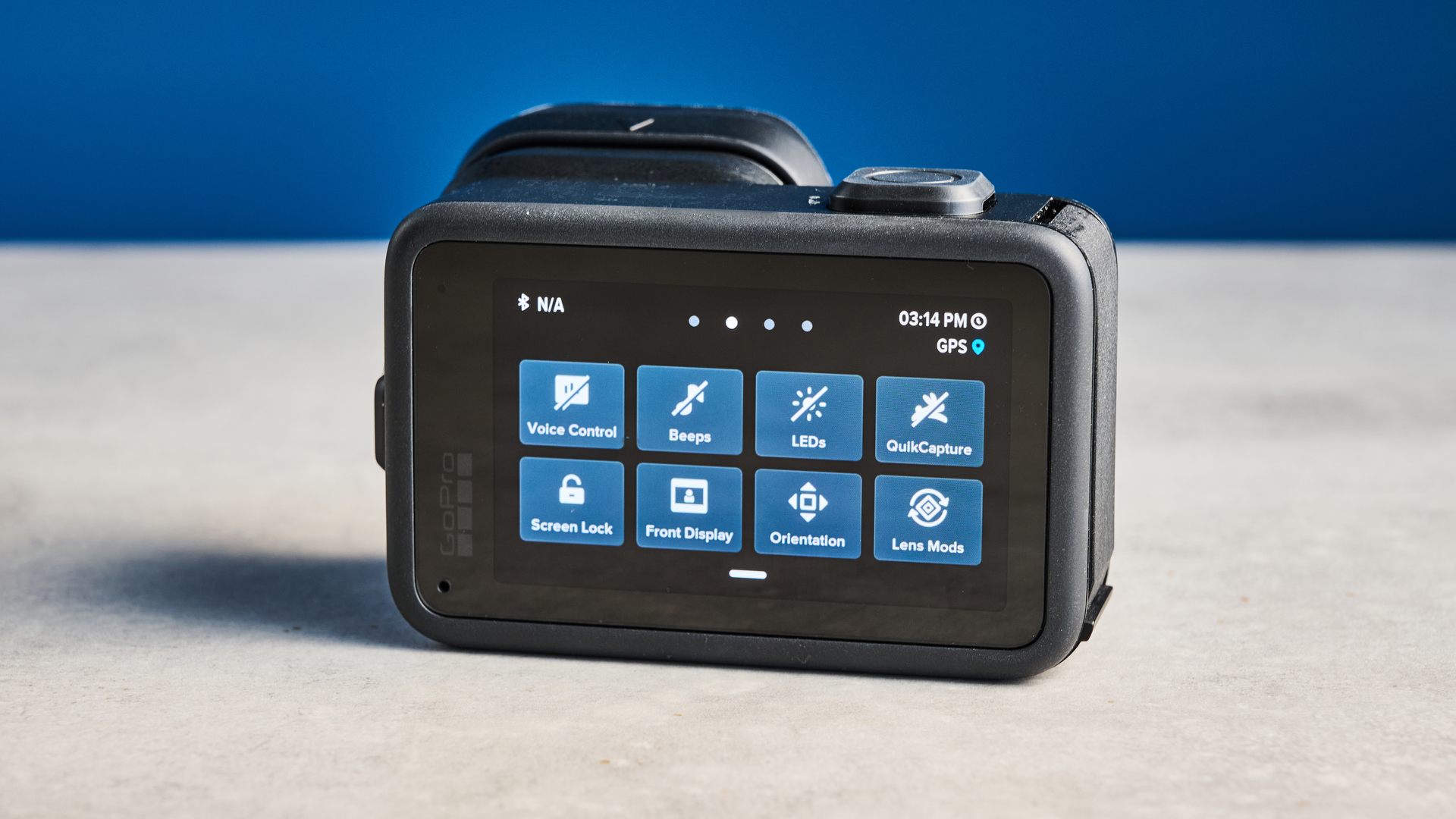 The GoPro Mission 1 Pro rear screen against a blue background
