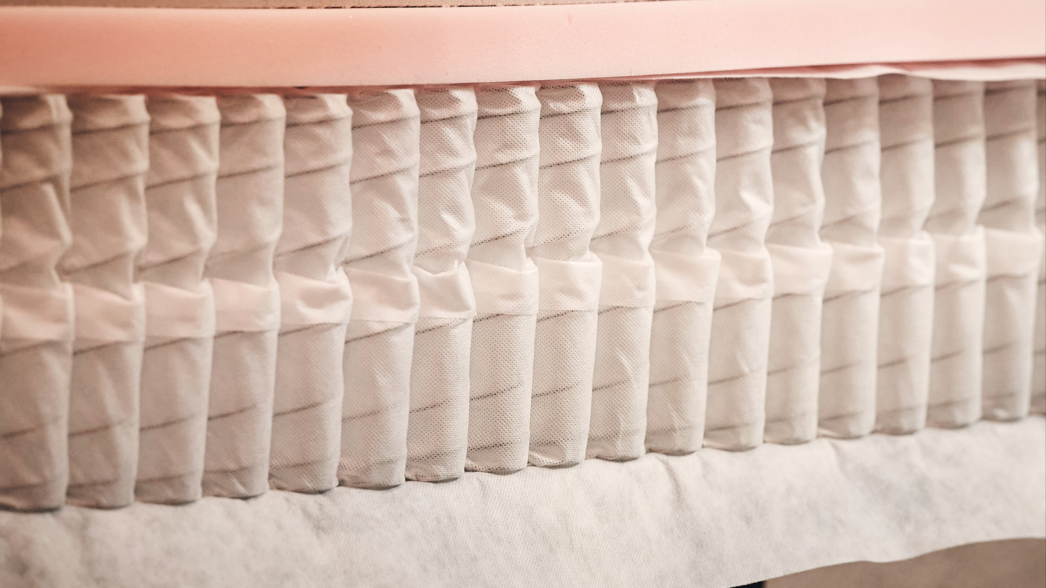 Coil layer in hybrid mattress