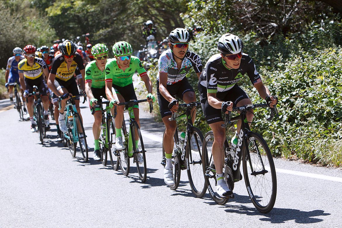 Dimension Data's Ben King doing a job for teammate Lachlan Morton