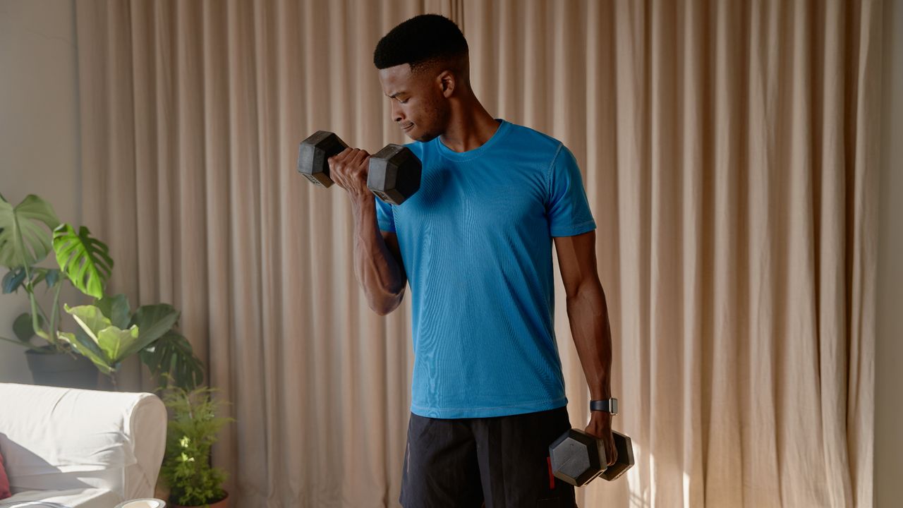 Man performing bicep curls with dumbbells