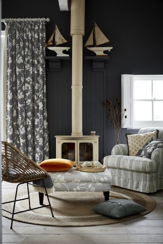 Black living room with curtains by Vanessa Arbuthnott