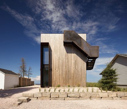 dramatic hero shot of timber boxy house exterior in Canada called The Sandbox