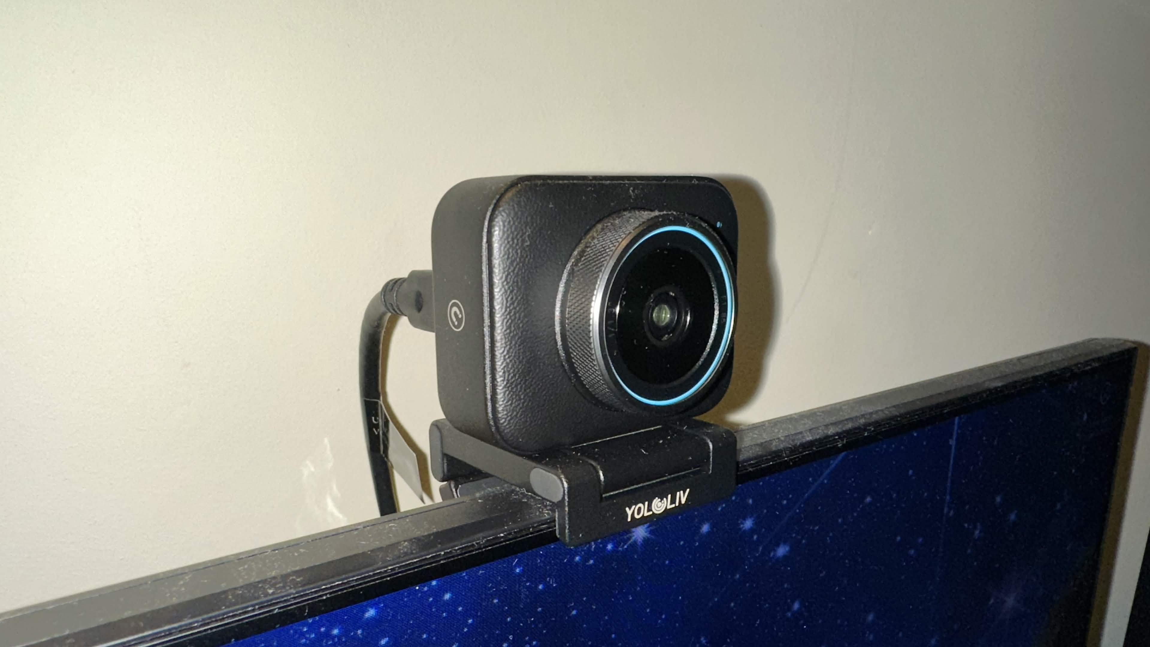 A YoloLiv YoloCam S3 on top of a gaming monitor