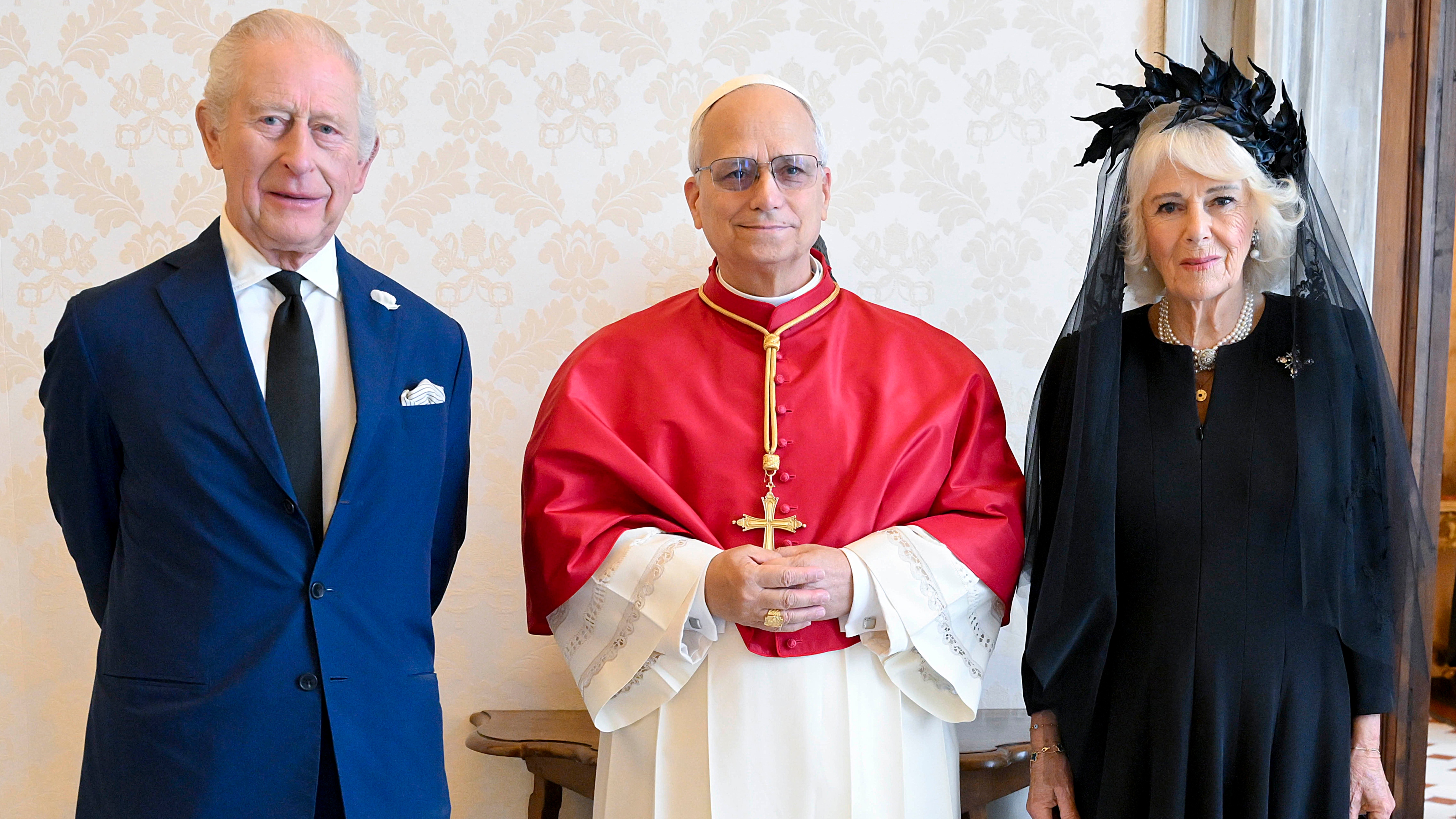 Pope Leo XVI poses with King Charles III and Queen Camilla during an audience at the Apostolic Palace on October 23, 2025