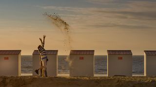 Jumping for joy – a pair of friends throw sand in the air in this photo by Tanja Zech in Knokke-Heist, Germany.