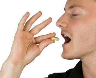 man taking pill