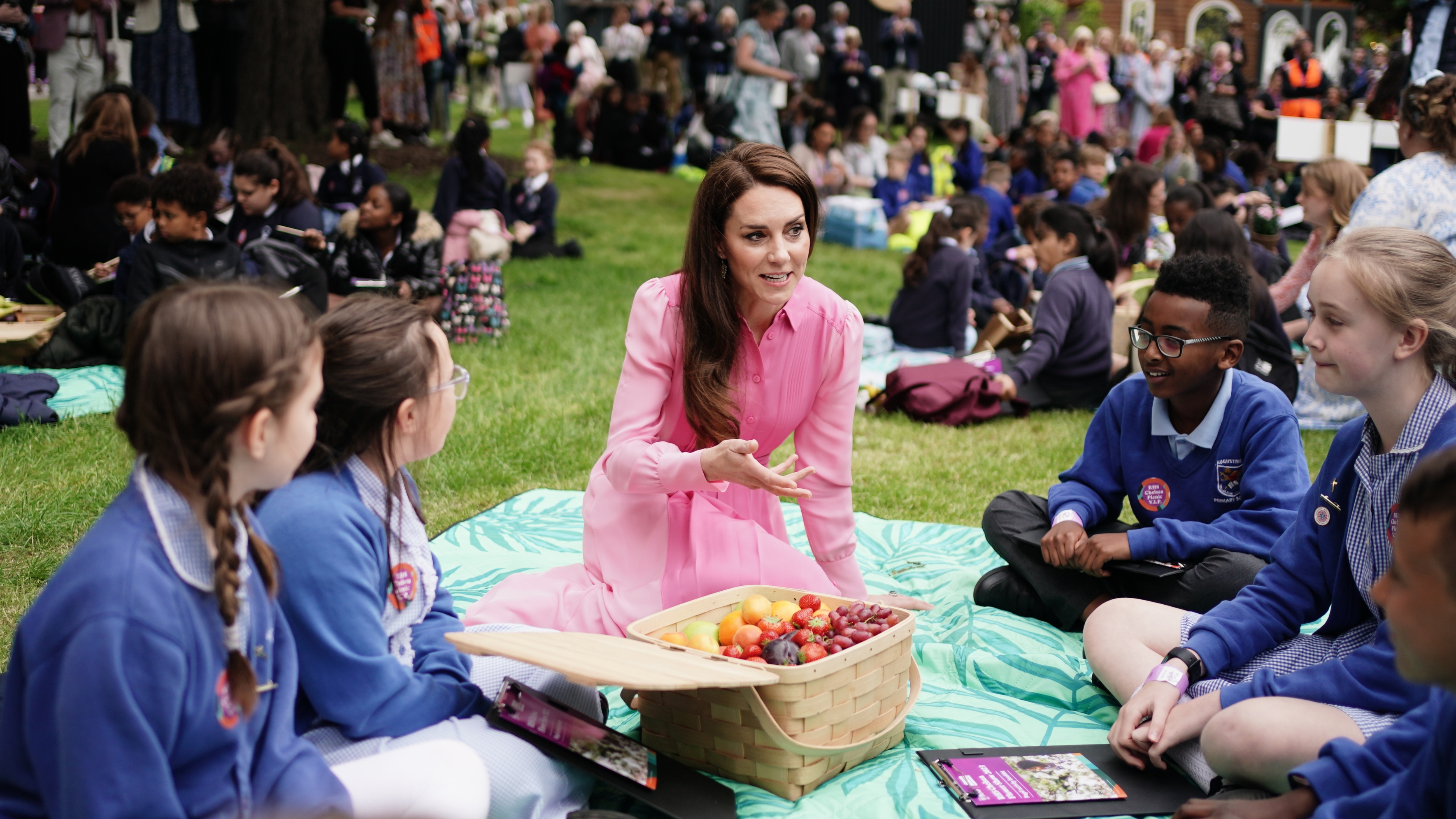 Catherine, Princess of Wales speaks to pupils from schools as she takes part in the first Children's Picnic at the RHS Chelsea Flower Show