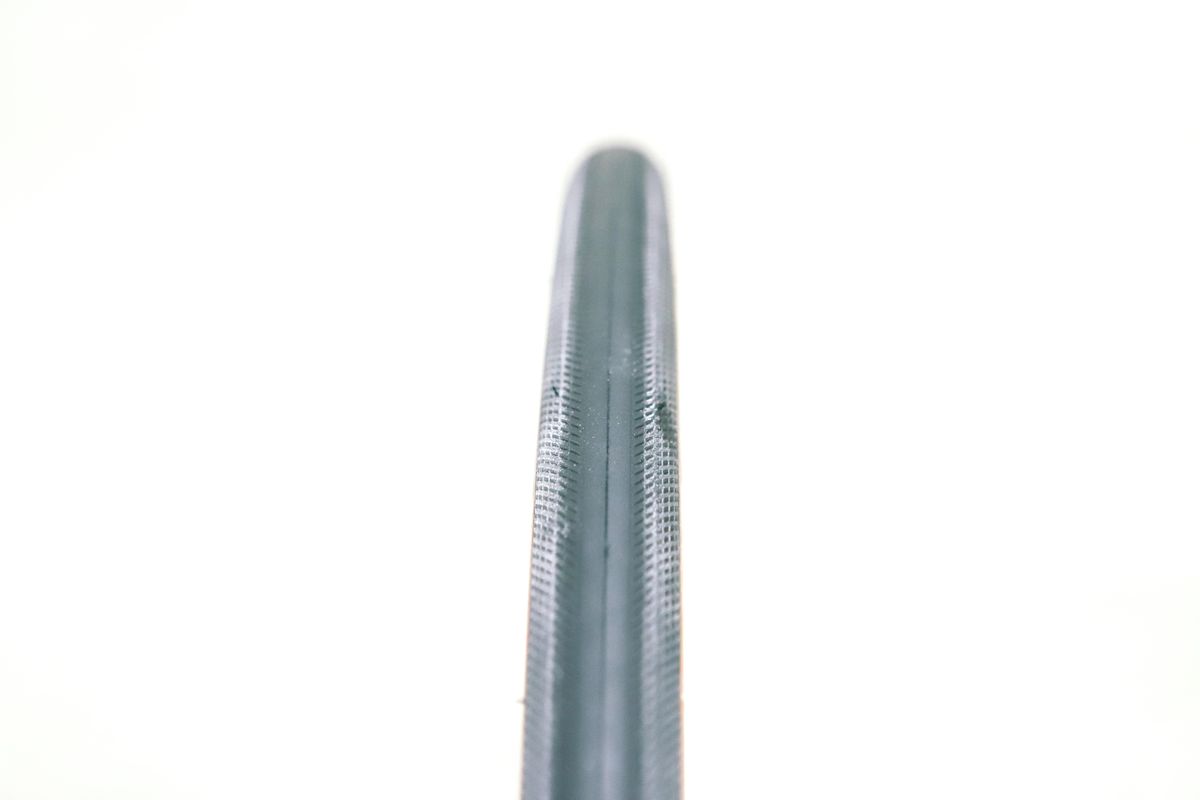 A tan bicycle tyre on a white background