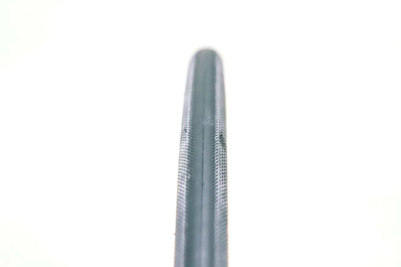 A tan bicycle tyre on a white background
